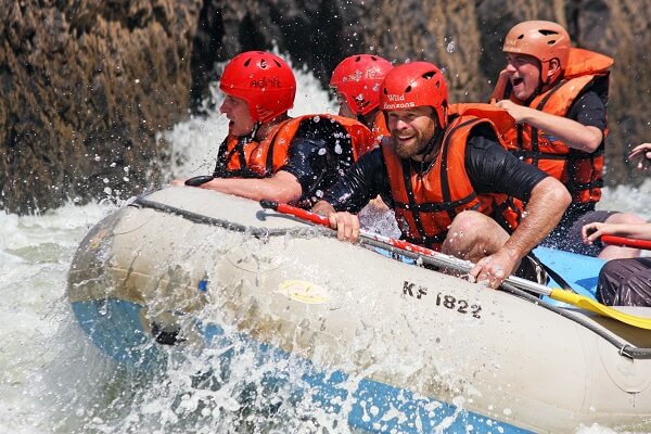 people enjoying white water rafting in victoria falls