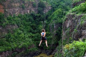 man doing the zipline across the gorge of victoria falls