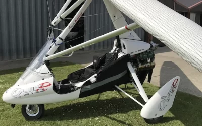 Modern white microlight aircraft with its wings collapsed